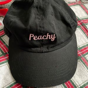 Newhattan 100% cotton black hat with “Peachy” written on it in cursive in pink